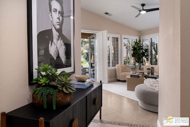 interior space with ceiling fan and vaulted ceiling