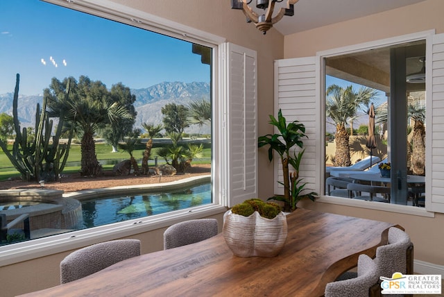 dining room featuring a mountain view