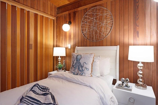 bedroom with wood walls