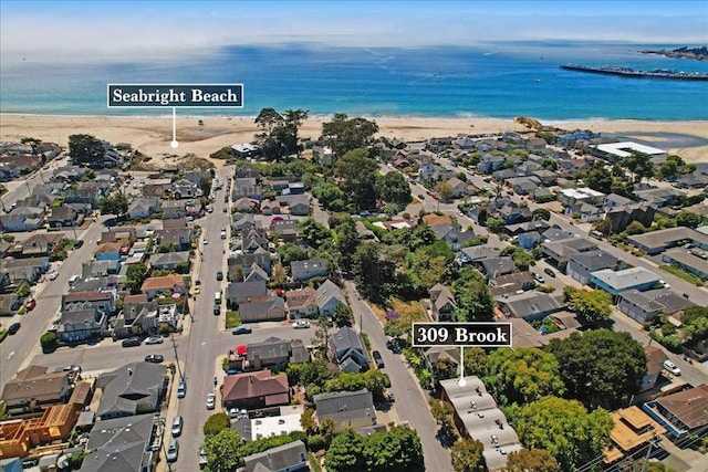 aerial view featuring a water view and a view of the beach