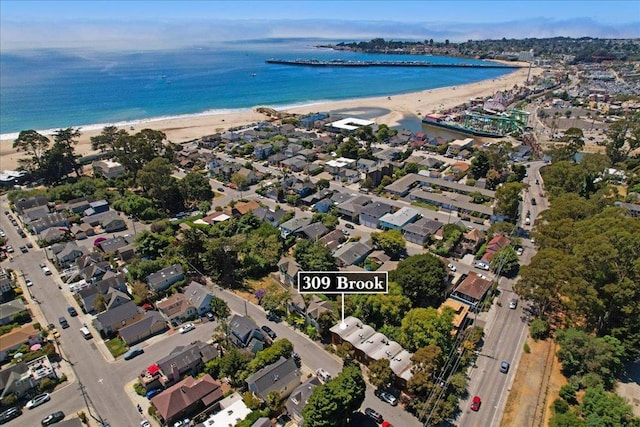 birds eye view of property featuring a water view and a view of the beach