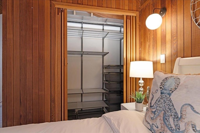 bedroom with wooden walls