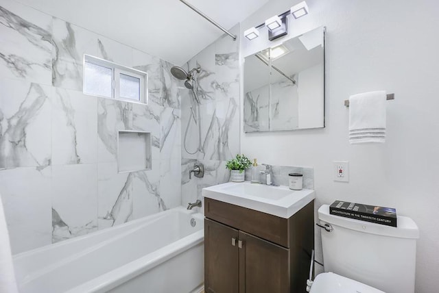 full bathroom with vanity, toilet, and tiled shower / bath combo