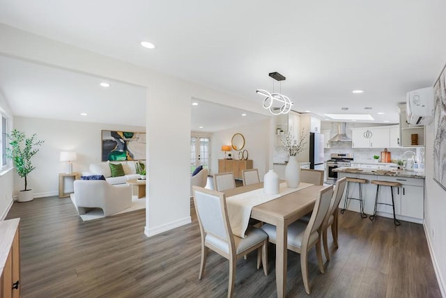 dining space with dark wood-type flooring and sink