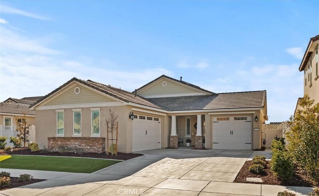 view of front of house with a garage and a front yard