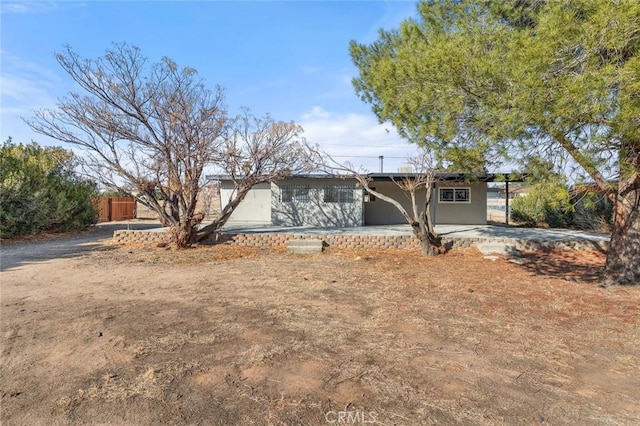 ranch-style home with a patio area