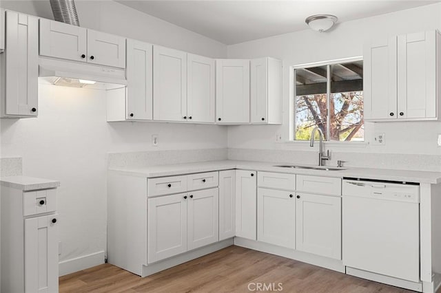 kitchen with white cabinetry, white dishwasher, sink, and light wood-type flooring