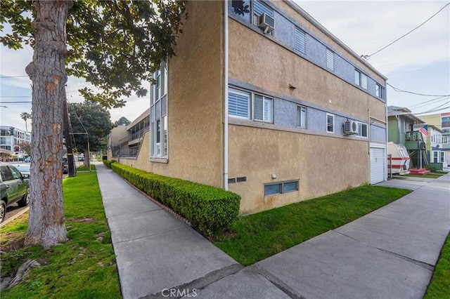 view of property exterior with a yard