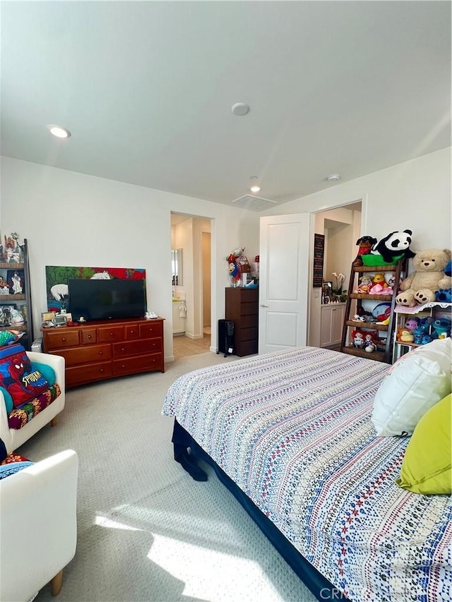 bedroom with light colored carpet