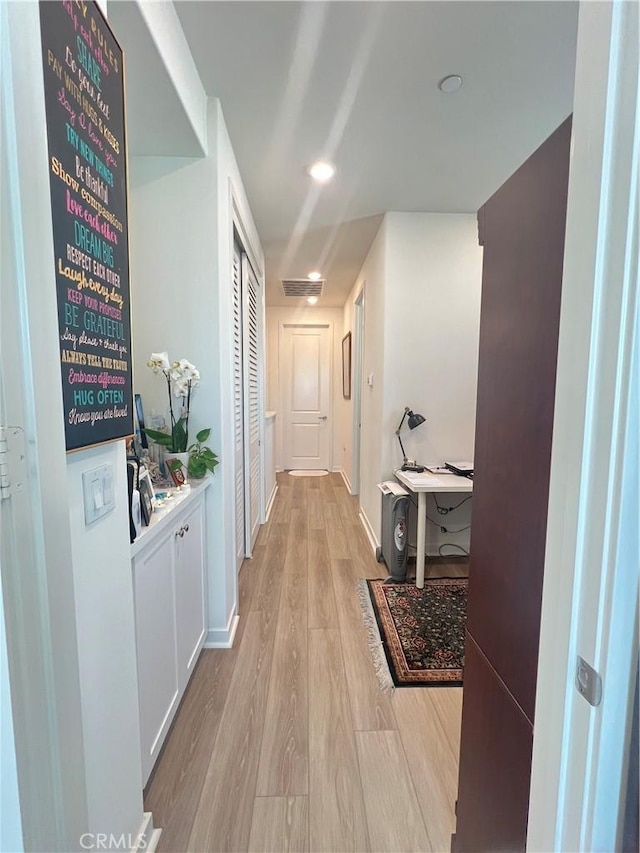 hallway featuring light wood-type flooring