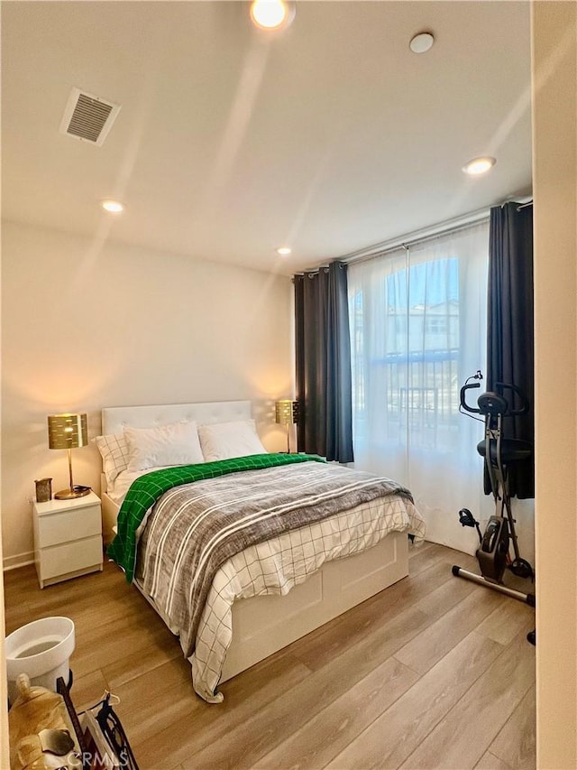 bedroom featuring hardwood / wood-style flooring