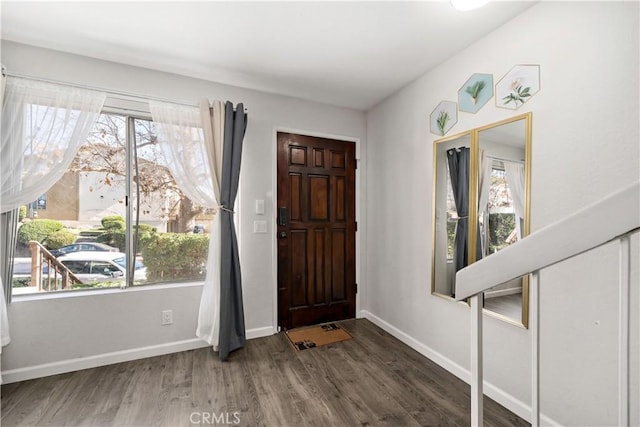 entryway with dark wood-type flooring