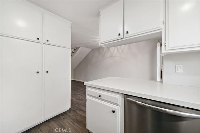 kitchen with stainless steel dishwasher, dark hardwood / wood-style floors, and white cabinets