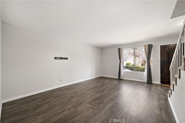 empty room featuring dark hardwood / wood-style flooring