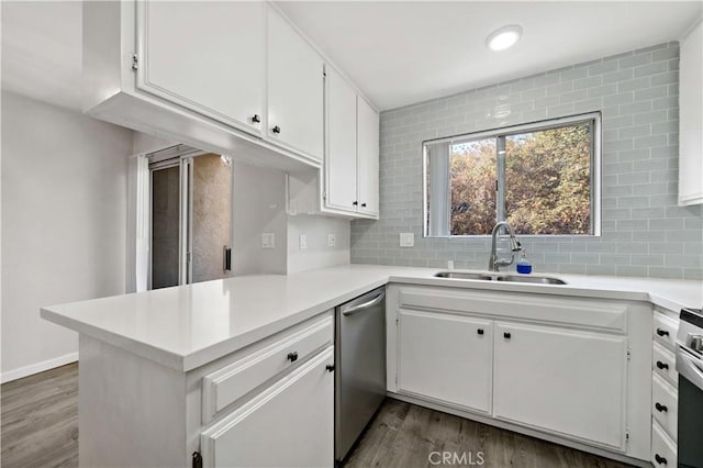 kitchen with sink, decorative backsplash, and white cabinets