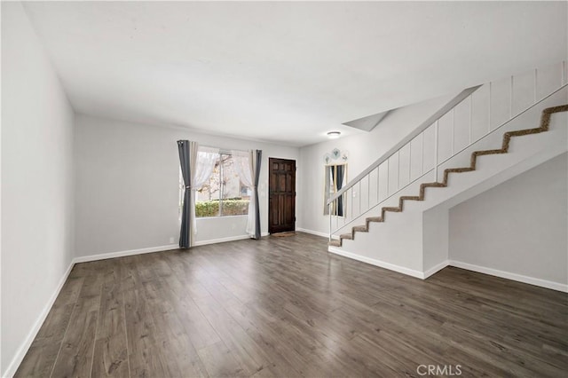 entrance foyer with dark hardwood / wood-style flooring