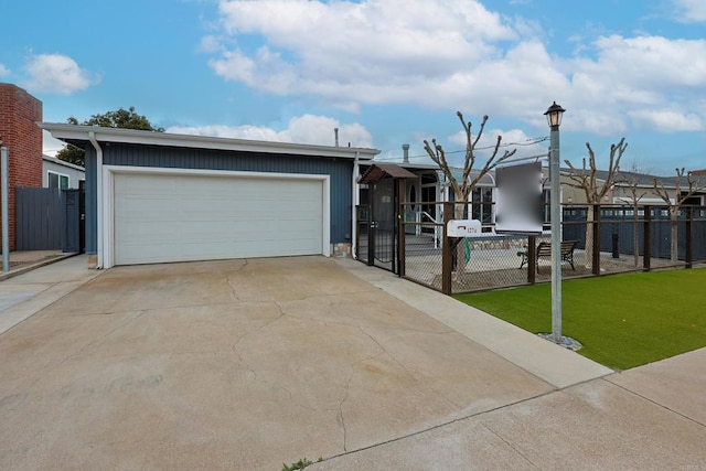 ranch-style home featuring a garage and a front yard