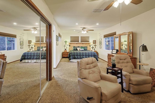 bedroom featuring ceiling fan, recessed lighting, light carpet, visible vents, and baseboards