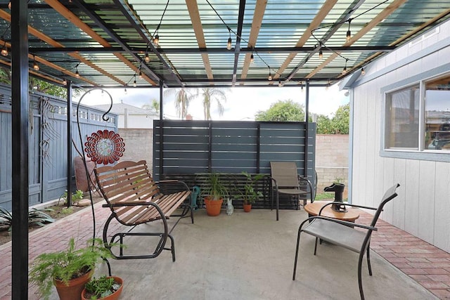 view of patio with fence and a pergola