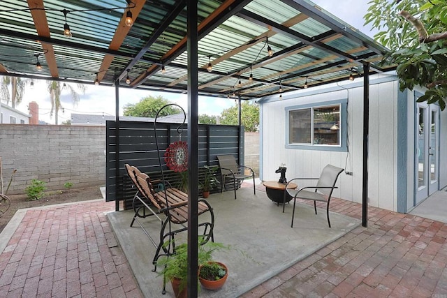 view of patio / terrace featuring fence and a pergola