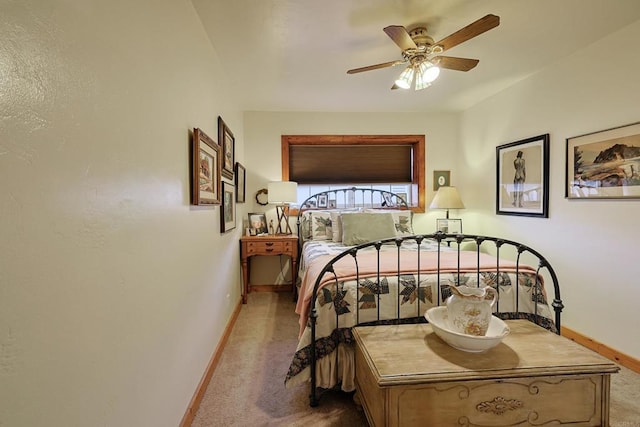 bedroom with light carpet, ceiling fan, and baseboards