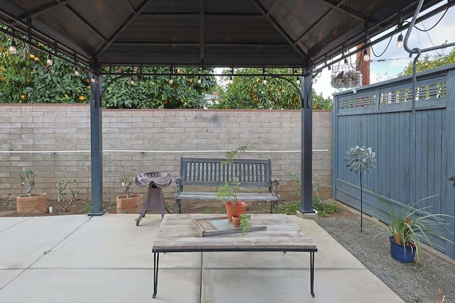 view of patio / terrace featuring a fenced backyard and a gazebo