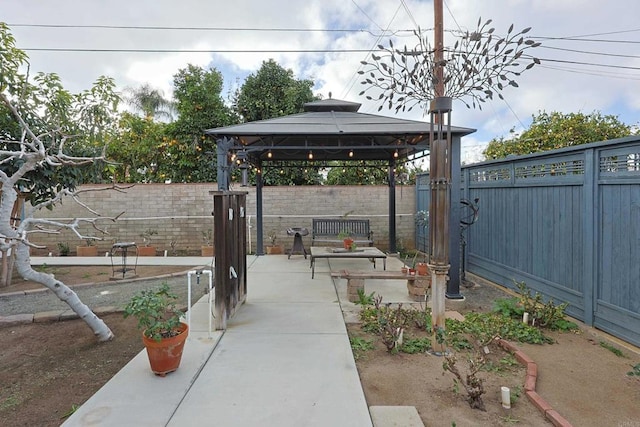 view of patio / terrace with a fenced backyard and a gazebo