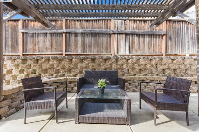 view of patio / terrace with an outdoor living space and a pergola