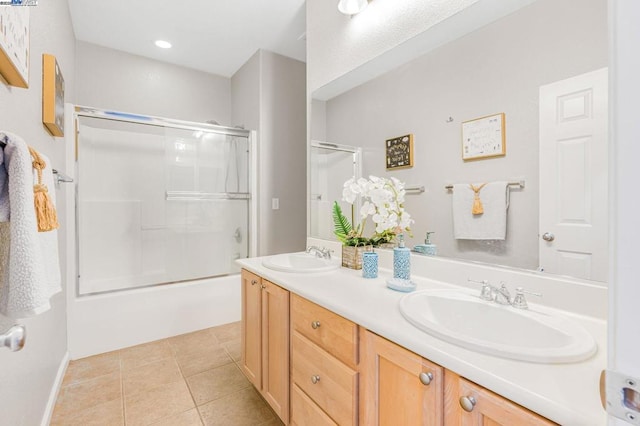 bathroom with vanity, shower / bath combination with glass door, and tile patterned flooring