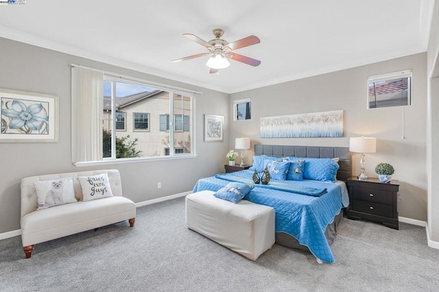 bedroom featuring crown molding, carpet floors, and ceiling fan