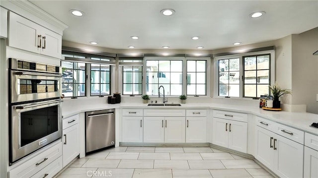 kitchen with white cabinetry, sink, plenty of natural light, and appliances with stainless steel finishes