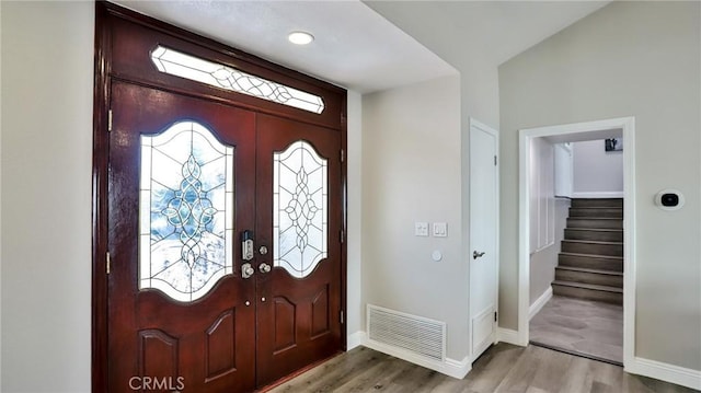 entrance foyer featuring french doors and wood-type flooring