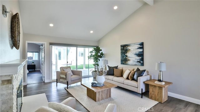 living room featuring dark wood-type flooring and high vaulted ceiling