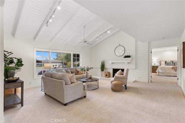 carpeted living room featuring beam ceiling, high vaulted ceiling, rail lighting, and ceiling fan