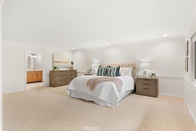 bedroom with ornamental molding and light carpet