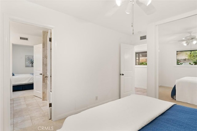 tiled bedroom with ceiling fan and a closet