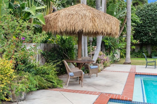 view of patio featuring a fenced in pool