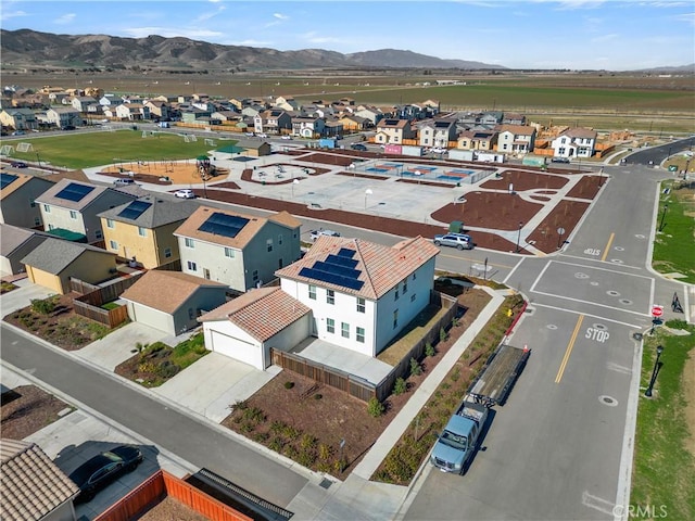 birds eye view of property featuring a mountain view