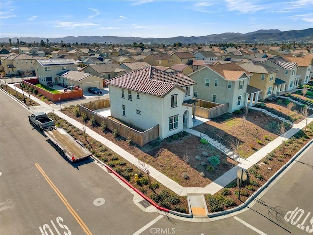 birds eye view of property with a mountain view