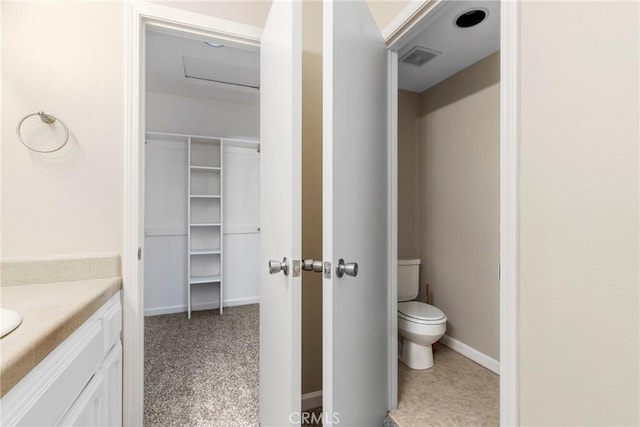 bathroom with vanity and toilet