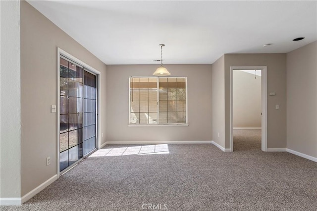 unfurnished room with light carpet