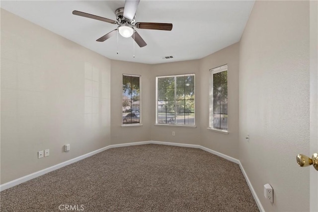 carpeted empty room with ceiling fan