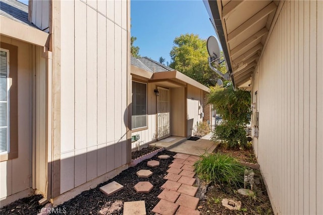 view of side of property with a patio area