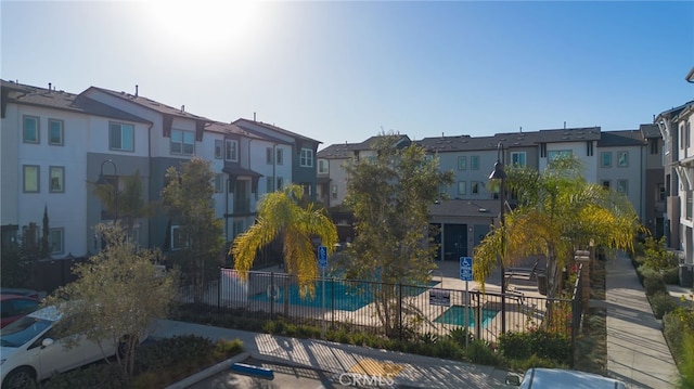 view of community featuring a pool and a patio area