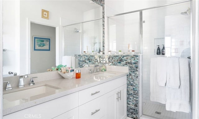 bathroom with vanity and a shower with shower door