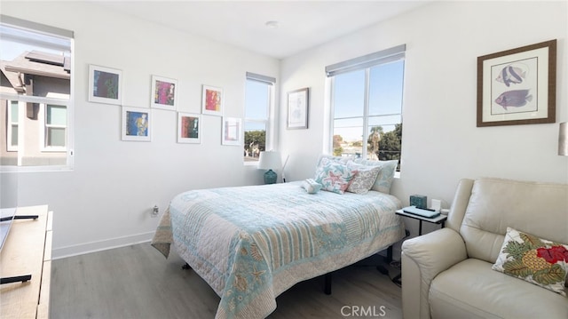 bedroom with hardwood / wood-style flooring