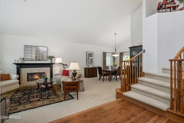 living room with high vaulted ceiling