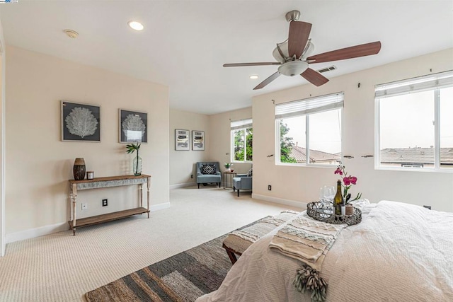 bedroom with light colored carpet and ceiling fan