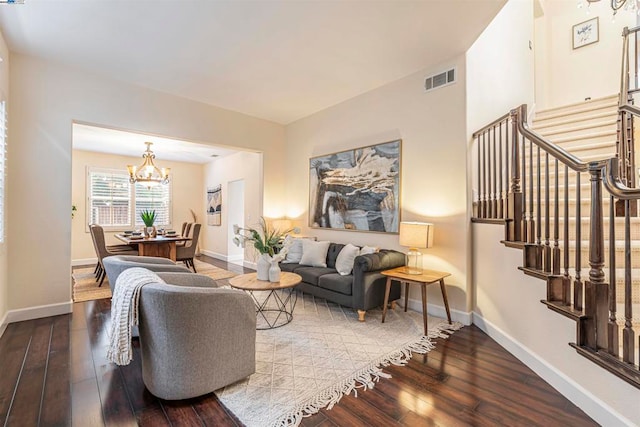 living room featuring hardwood / wood-style floors and a chandelier