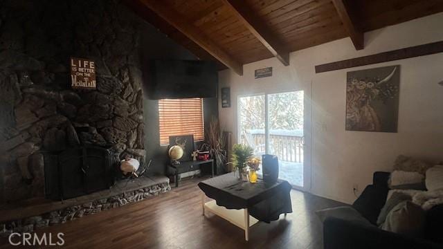 living room featuring wood ceiling, a fireplace, lofted ceiling with beams, and hardwood / wood-style flooring